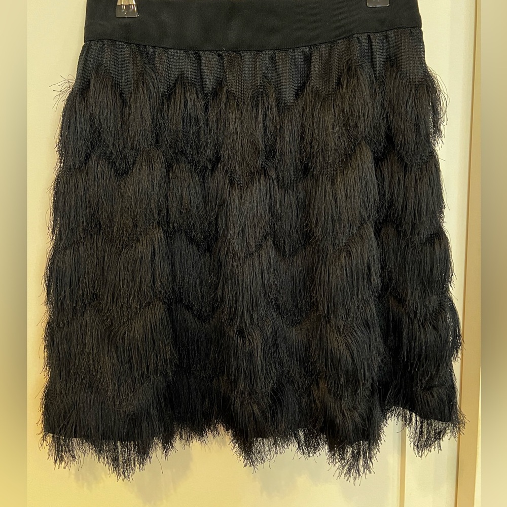 Black fringe skirt from BR sz Small. Versatile piece to wear. Good condition!
